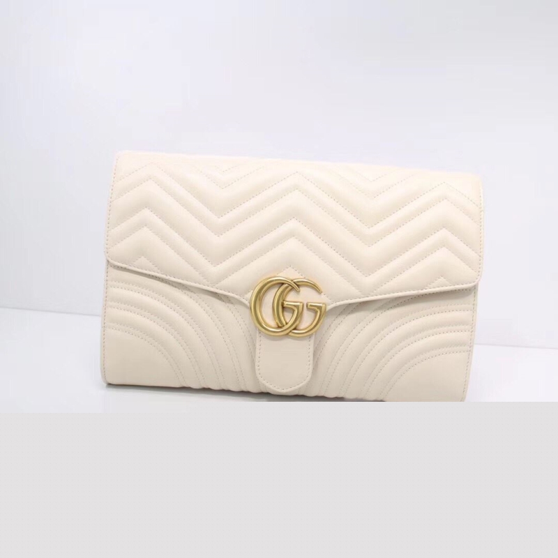 G*u*i clutch bags